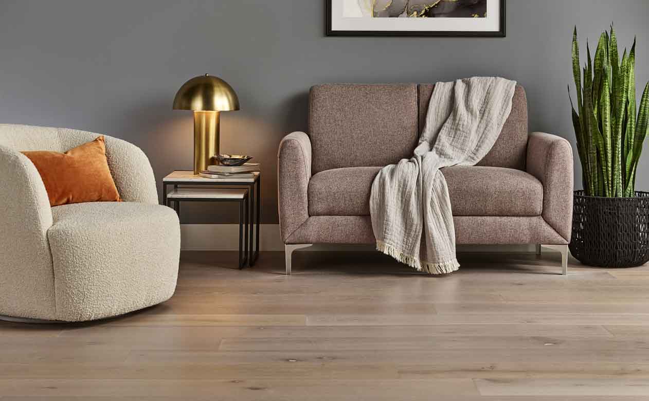 Hardwood flooring with brown table and blue chairs 