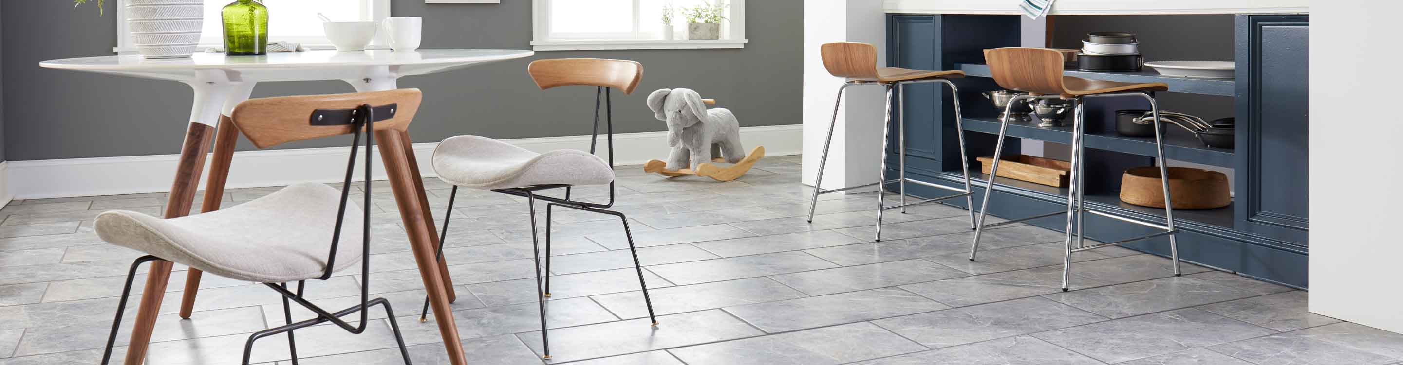 Dining area with gray tile flooring